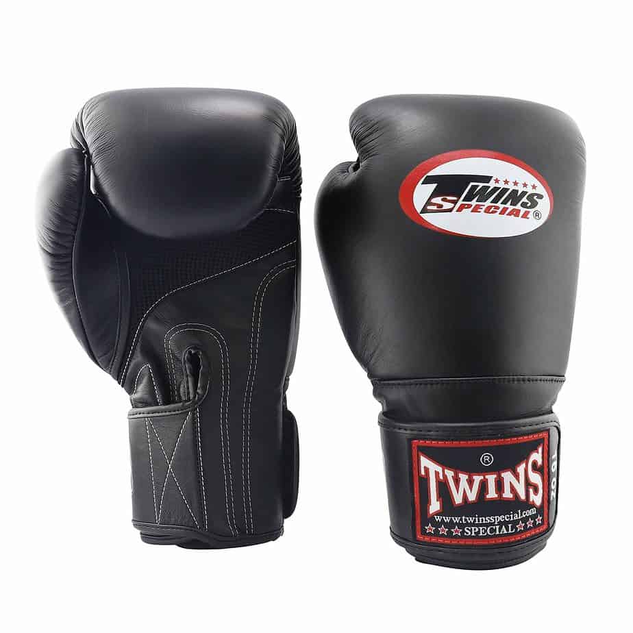 Boxing gloves designed by Twins for ultimate performance and protection. Crafted with high-quality materials, this glove offer a comfortable fit and enhanced grip. Ideal for boxing enthusiasts, they are highly recommended as 8 oz sparring gloves.